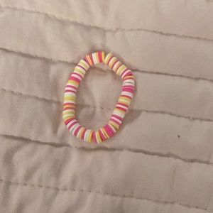Pink, white, and pink bracelet, and a white and purple bracelet